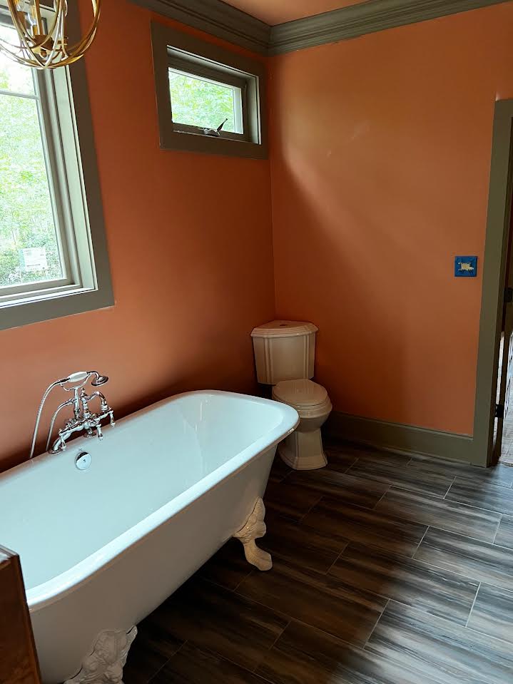 Clawfoot tub and toilet installation in a renovated Northshore Louisiana bathroom